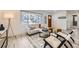 Comfortable living room featuring a neutral color palette, stylish decor, and lots of natural light at 3440 Chase St, Wheat Ridge, CO 80212