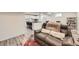 Living room featuring a recliner and sight lines into the kitchen and dining areas, perfect for entertaining at 3440 Chase St, Wheat Ridge, CO 80212