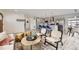 Spacious open-concept design featuring a living room, kitchen, and dining area with modern finishes at 3440 Chase St, Wheat Ridge, CO 80212