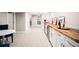 Finished basement with bar, seating area, doors, and staircase at 1918 S Lincoln St, Denver, CO 80210