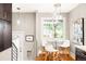 Breakfast nook features a modern table and chairs with views of the backyard area at 1918 S Lincoln St, Denver, CO 80210
