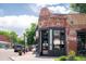 Brick building exterior showcasing a modern storefront with large windows and street access at 1918 S Lincoln St, Denver, CO 80210