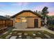 Detached brick garage with wooden siding, and stone pathway at 1918 S Lincoln St, Denver, CO 80210