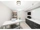 Finished basement home office with desk, shelves, storage, and light at 1918 S Lincoln St, Denver, CO 80210