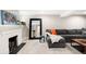 Finished basement living room with fireplace, couch, and large mirror at 1918 S Lincoln St, Denver, CO 80210
