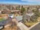 Aerial view of neighborhood with trees and distant mountains at 7209 S Sherman St, Centennial, CO 80122