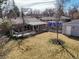 Backyard featuring a well maintained lawn, a deck, and a shed at 7209 S Sherman St, Centennial, CO 80122