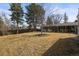 Spacious backyard with mature trees and plenty of room for outdoor activities and gardening at 7209 S Sherman St, Centennial, CO 80122