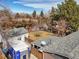 Aerial view of backyard, garage, and neighboring houses with fenced yards at 7209 S Sherman St, Centennial, CO 80122
