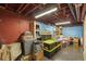 Unfinished basement space for storage with exposed ceiling and red painted walls at 7209 S Sherman St, Centennial, CO 80122
