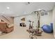 Spacious finished basement with exercise equipment, a large TV, and comfortable seating area at 7209 S Sherman St, Centennial, CO 80122