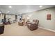 Finished basement featuring neutral carpeting, two reclining chairs, and home fitness equipment at 7209 S Sherman St, Centennial, CO 80122