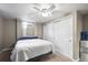Bedroom with neutral walls, a ceiling fan, and a sliding door closet at 7209 S Sherman St, Centennial, CO 80122
