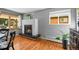 Inviting dining area with a modern fireplace, hardwood floors, and natural light from a nearby window at 7209 S Sherman St, Centennial, CO 80122