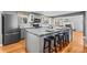Stylish kitchen featuring an island with bar seating, modern appliances, and elegant gray cabinetry at 7209 S Sherman St, Centennial, CO 80122