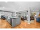 Open-concept kitchen with a large island, stainless steel appliances, and seamless flow into the living area at 7209 S Sherman St, Centennial, CO 80122