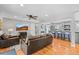 Cozy living room featuring hardwood floors, ceiling fan, and an open layout to the kitchen at 7209 S Sherman St, Centennial, CO 80122