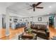 Open-concept living room with a stylish kitchen island and comfortable seating area at 7209 S Sherman St, Centennial, CO 80122