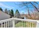 View from the second story deck overlooks backyard with mature trees and the surrounding area at 6707 S Elizabeth St, Centennial, CO 80122