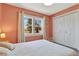 Inviting bedroom showcases a large window, natural light, and closet at 6707 S Elizabeth St, Centennial, CO 80122