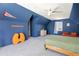 Large bedroom with a light ceiling fan, carpet, and charming dormer windows that allow natural light at 6707 S Elizabeth St, Centennial, CO 80122