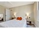 Bright bedroom showcasing natural light, neutral colors, and closet at 6707 S Elizabeth St, Centennial, CO 80122
