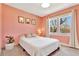 Bright bedroom featuring natural light, neutral colors, and a view at 6707 S Elizabeth St, Centennial, CO 80122