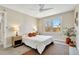 Inviting bedroom featuring large window, neutral colors, and natural light at 6707 S Elizabeth St, Centennial, CO 80122