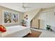 Cozy bedroom features a large window, a ceiling fan, and unique angled walls at 6707 S Elizabeth St, Centennial, CO 80122