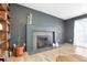 Living room with an elegant fireplace, wooden shelves, and a cozy seating area at 6707 S Elizabeth St, Centennial, CO 80122