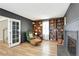 Cozy living room with built-in bookshelves, fireplace, and comfortable seating at 6707 S Elizabeth St, Centennial, CO 80122