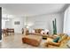 Spacious living room with a brown sofa, stylish decor, and dining space at 6707 S Elizabeth St, Centennial, CO 80122