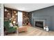 Cozy living room with built-in bookshelves, fireplace, and comfortable seating at 6707 S Elizabeth St, Centennial, CO 80122