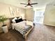 Bright bedroom featuring modern decor, a ceiling fan, and plush carpeting at 6895 W 84Th Way # 4, Arvada, CO 80003