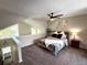 Cozy bedroom featuring vaulted ceiling, neutral decor, and plush carpeting at 6895 W 84Th Way # 4, Arvada, CO 80003