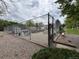 Charming community garden with raised beds, picnic tables, and tool sheds, enclosed by a secure chain-link fence at 6895 W 84Th Way # 4, Arvada, CO 80003