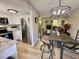 Open dining area with modern lighting fixtures, adjacent to an updated kitchen at 6895 W 84Th Way # 4, Arvada, CO 80003