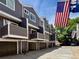 Attractive townhouse complex with private balconies and attached garages, showcasing well-maintained exteriors and curb appeal at 6895 W 84Th Way # 4, Arvada, CO 80003