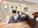 Stylish living room offers plenty of seating, natural light, and a cozy fireplace at 6895 W 84Th Way # 4, Arvada, CO 80003