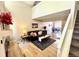 Bright living room boasts vaulted ceilings, neutral paint, and comfortable furnishings at 6895 W 84Th Way # 4, Arvada, CO 80003