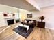 Comfortable living room features a decorative fireplace, attractive sofa, and stylish decor at 6895 W 84Th Way # 4, Arvada, CO 80003