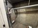 Furnace located in a utility closet with exposed ductwork and concrete walls, showcasing essential home systems at 6895 W 84Th Way # 4, Arvada, CO 80003