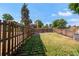 Spacious fenced backyard with healthy grass, a rock garden, and plenty of room for outdoor enjoyment at 5090 W 36Th Ave, Denver, CO 80212
