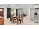 Dining area with hardwood floors, an abundance of light, and modern black and white decor at 5090 W 36Th Ave, Denver, CO 80212