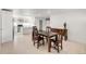 Hardwood floor dining room with updated lighting and a view into the modern kitchen at 5090 W 36Th Ave, Denver, CO 80212