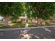 Charming single-story home with mature trees, lush greenery, and a well-maintained front yard at 5090 W 36Th Ave, Denver, CO 80212