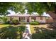 Inviting single-Gathering home with a well-kept lawn and concrete walkway leading to the front door at 5090 W 36Th Ave, Denver, CO 80212
