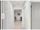 Bright hallway featuring wood-look floors and modern decor at 5090 W 36Th Ave, Denver, CO 80212
