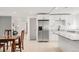 Updated kitchen with stainless steel appliances and an island, as viewed from the dining room at 5090 W 36Th Ave, Denver, CO 80212