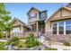 Charming two-story home with well-maintained landscaping and a stone-accented facade at 529 Gallegos Cir, Erie, CO 80516